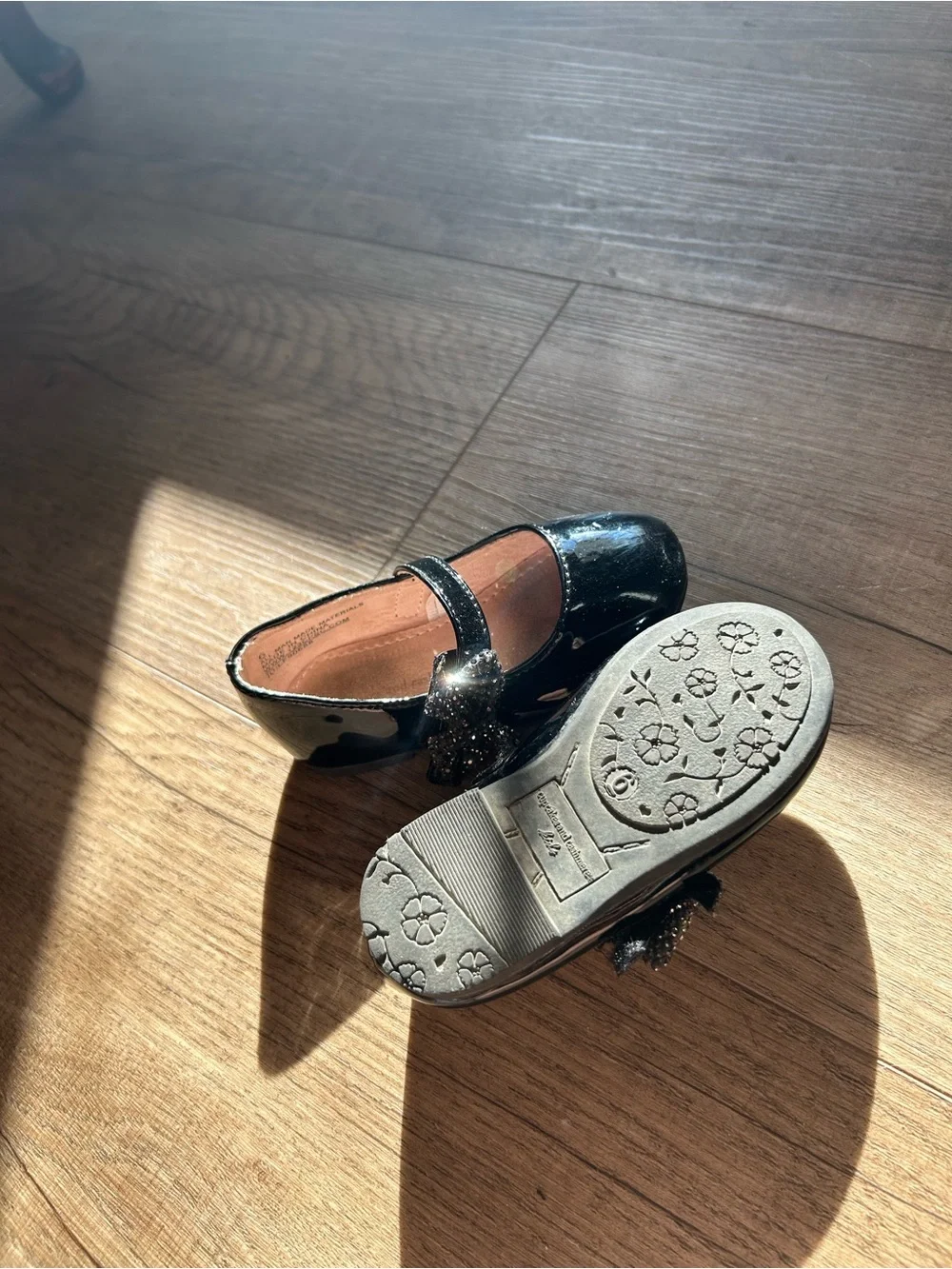 cupcakes & cashmere Black Patent Mary Jane Flats with Decorative Flower